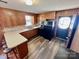 Updated kitchen featuring black appliances, a breakfast bar, and light counter tops at 1168 Mcclain Rd, Hiddenite, NC 28636