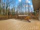 Wide, wood deck, great for outdoor entertaining, overlooking a serene, wooded backyard at 1200 Carey Ct, Charlotte, NC 28210