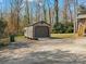 The detached garage provides parking and storage space, with a driveway enhancing accessibility at 1200 Carey Ct, Charlotte, NC 28210