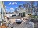 This outdoor space features a patio with an outdoor fireplace and mature landscaping at 124 Helton Ln, Fort Mill, SC 29708