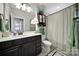 This bathroom features a black vanity, patterned shower curtain, and decorative towels at 124 Helton Ln, Fort Mill, SC 29708