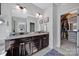 Bathroom with double sink vanity, granite counters, and linen closet at 124 Helton Ln, Fort Mill, SC 29708