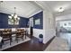 Elegant dining room with blue textured walls, wainscoting, and hardwood floors at 124 Helton Ln, Fort Mill, SC 29708