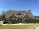 A well-maintained clubhouse building with stone accents and a neatly landscaped lawn at 124 Helton Ln, Fort Mill, SC 29708