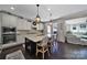 Spacious kitchen featuring a large center island with bar seating, stainless appliances, and modern finishes at 124 Helton Ln, Fort Mill, SC 29708