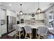 Kitchen island featuring granite countertops, pendant lighting, and seating for three at 124 Helton Ln, Fort Mill, SC 29708