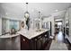 Open kitchen floor plan featuring a large center island with bar seating, stainless appliances, and hardwood floors at 124 Helton Ln, Fort Mill, SC 29708