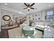 Open-concept living room featuring a dining area, a kitchen, and hardwood floors at 124 Helton Ln, Fort Mill, SC 29708