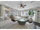 Bright and airy living room featuring large windows, white sofas, and hardwood floors at 124 Helton Ln, Fort Mill, SC 29708