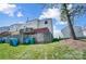 A view of this unit's back yard, including a raised back deck and a partial wood fence at 130 Water Oak Dr, Pineville, NC 28134