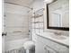 Bright bathroom features patterned tile floor, white vanity, and a shower-tub combo at 130 Water Oak Dr, Pineville, NC 28134