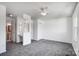 Well-lit bedroom features built-in vanity, ceiling fan, neutral carpet, and easy access to the en-suite bathroom at 130 Water Oak Dr, Pineville, NC 28134