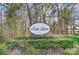 Elegant 'Park Lake' community sign nestled in lush landscaping, welcoming residents and visitors at 130 Water Oak Dr, Pineville, NC 28134