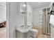 Bathroom with a vintage sink, toilet, and a bathtub with shower, featuring a neutral color scheme at 1339 Hill St, Albemarle, NC 28001