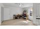 Bright bedroom featuring light-colored walls, wood floors, a ceiling fan, and a cat tower at 1339 Hill St, Albemarle, NC 28001