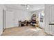 Bright bedroom featuring light-colored walls, wood floors, a ceiling fan, and a cat tower at 1339 Hill St, Albemarle, NC 28001