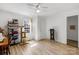 Bright bedroom featuring light-colored walls, wood floors, a ceiling fan, and a storage organizer at 1339 Hill St, Albemarle, NC 28001