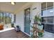 Inviting front porch featuring a plant display, wooden deck, and well-lit entrance at 1339 at 1339 Hill St, Albemarle, NC 28001