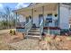 Charming front porch with decorative plants and stone landscaping leading to the entrance at 1339 Hill St, Albemarle, NC 28001