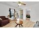 Bright living room with hardwood floors, multiple windows, and access to the porch at 1339 Hill St, Albemarle, NC 28001