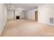 Basement featuring neutral carpet and white painted walls, trim, and a fireplace at 1347 Lightwood Dr, Matthews, NC 28105