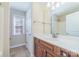 Bathroom features wooden cabinetry with chrome faucet and white counter at 1347 Lightwood Dr, Matthews, NC 28105