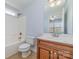 Bathroom featuring white vanity, tub, and toilet at 1347 Lightwood Dr, Matthews, NC 28105