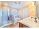 Bathroom with walk-in shower, soaking tub, and double vanity at 1347 Lightwood Dr, Matthews, NC 28105