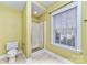 Bright bathroom with a walk-in shower and a window providing natural light at 1347 Lightwood Dr, Matthews, NC 28105