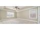 Spacious bedroom with neutral carpet and ample natural light at 1347 Lightwood Dr, Matthews, NC 28105