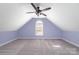 Bedroom featuring neutral carpet, lilac painted walls, white trim, and a ceiling fan with lights at 1347 Lightwood Dr, Matthews, NC 28105