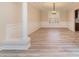 Dining room featuring elegant wainscoting, neutral walls, stunning chandelier, and beautiful hardwood floors at 1347 Lightwood Dr, Matthews, NC 28105