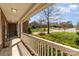 Inviting front porch with white railings, providing a cozy outdoor space to relax and enjoy the neighborhood at 1347 Lightwood Dr, Matthews, NC 28105