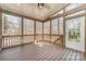 Relaxing sunroom enclosed with large windows and a wood deck at 1347 Lightwood Dr, Matthews, NC 28105