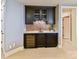 Stylish bar area featuring custom cabinetry, a wine cooler, and a unique backsplash at 1355 Wyndmere Hills Ln, Matthews, NC 28105