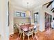 Cozy dining area with bench seating, pendant lighting, and natural light at 1355 Wyndmere Hills Ln, Matthews, NC 28105