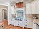 Close up of chef's kitchen featuring granite countertops, tiled backsplash, range and stainless appliances at 1355 Wyndmere Hills Ln, Matthews, NC 28105