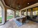 Beautiful covered patio with wicker furniture, a patterned rug, and outdoor lounge space at 1355 Wyndmere Hills Ln, Matthews, NC 28105