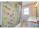 Cozy bathroom features a tub with shower and a single sink vanity with neutral paint at 1414 S Post Rd, Shelby, NC 28152