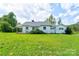 Charming single-story home with a well-maintained lawn and classic architectural details at 1414 S Post Rd, Shelby, NC 28152