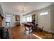 Bright living room features hardwood floors, a fireplace, and a charming chandelier at 1414 S Post Rd, Shelby, NC 28152