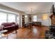 Sunlit living room boasts hardwood floors, fireplace, and built-in bookshelves at 1414 S Post Rd, Shelby, NC 28152