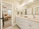 Bright bathroom boasting double sinks and an adjacent bedroom, combining functionality with inviting design at 144 Morgan Bluff Rd, Mooresville, NC 28117