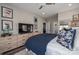 Serene bedroom featuring a dresser, stylish decor, and a comfortable bed with blue pillows at 150 Shields Dr, Lincolnton, NC 28092