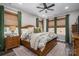 Calm main bedroom featuring a large bed, soft lighting, and stylish decor at 150 Shields Dr, Lincolnton, NC 28092