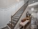 Elegant staircase with wood and iron railings and a cozy landing area at 150 Shields Dr, Lincolnton, NC 28092