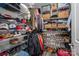 Organized walk-in closet featuring shelving, hanging rods, and ample storage space at 150 Shields Dr, Lincolnton, NC 28092