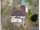 Aerial view showcasing the home's spacious backyard and patio area, perfect for outdoor entertaining at 155 Rivercliff Dr, Stony Point, NC 28678