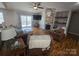 Comfortable living room with hardwood floors, fireplace, and natural light; ideal for relaxation at 155 Rivercliff Dr, Stony Point, NC 28678