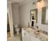 Bathroom featuring double sinks with decorative faucets, ample counter space, and patterned tile flooring at 1640 Winthrop Ln, Monroe, NC 28110